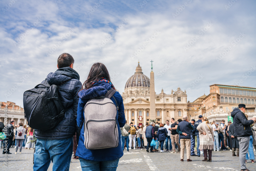 Tourists couple visit Vatican city and St. Peter's Basilica church in Rome. Italy
