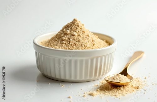 Lecithin powder in white bowl with gold spoon. Healthy organic sunflower lecithin ingredient. Natural dietary supplement, promotes liver health. Nutritious powder pile on white background.