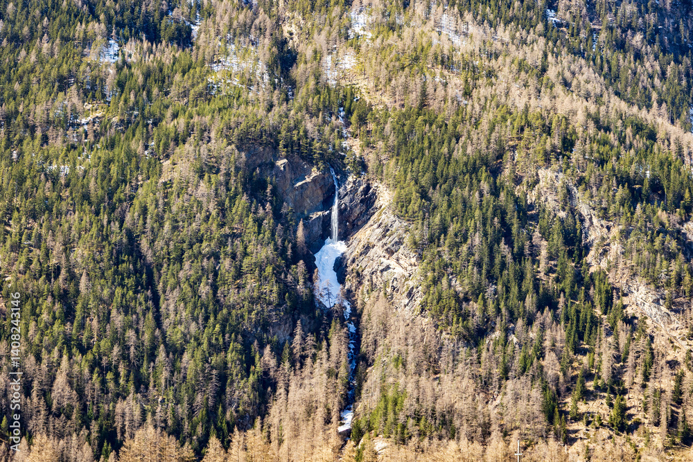 High alpine waterfall in melting snow, Ötztal, Austria, 20 March 2025..