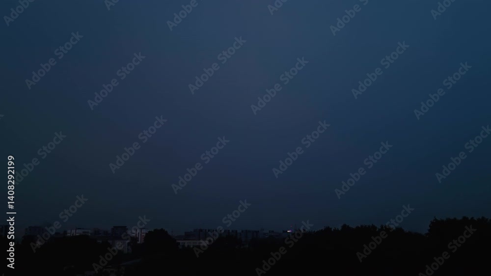 Bright lightning in dark night sky. Thunderstorm over city. Bright lightning in dark night sky. Thunderstorm over city.