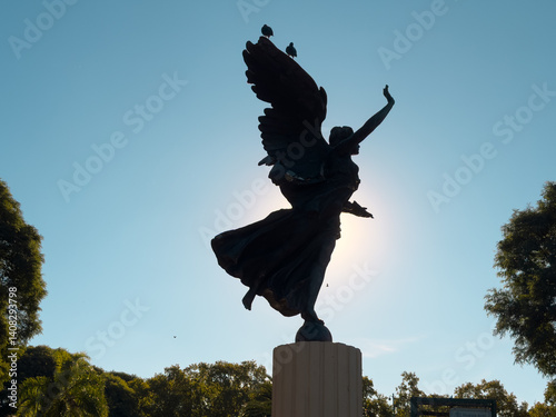 Angel Statue with birds on it