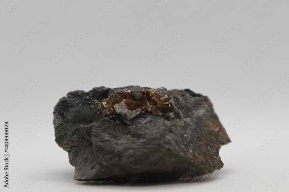 Naklejka premium Pyrite in a rock isolated on a white background. natural silver pyrite gem on white background. Pyrrhotite or Pyrite from Baska, Frydek Mistek, Czech republic 