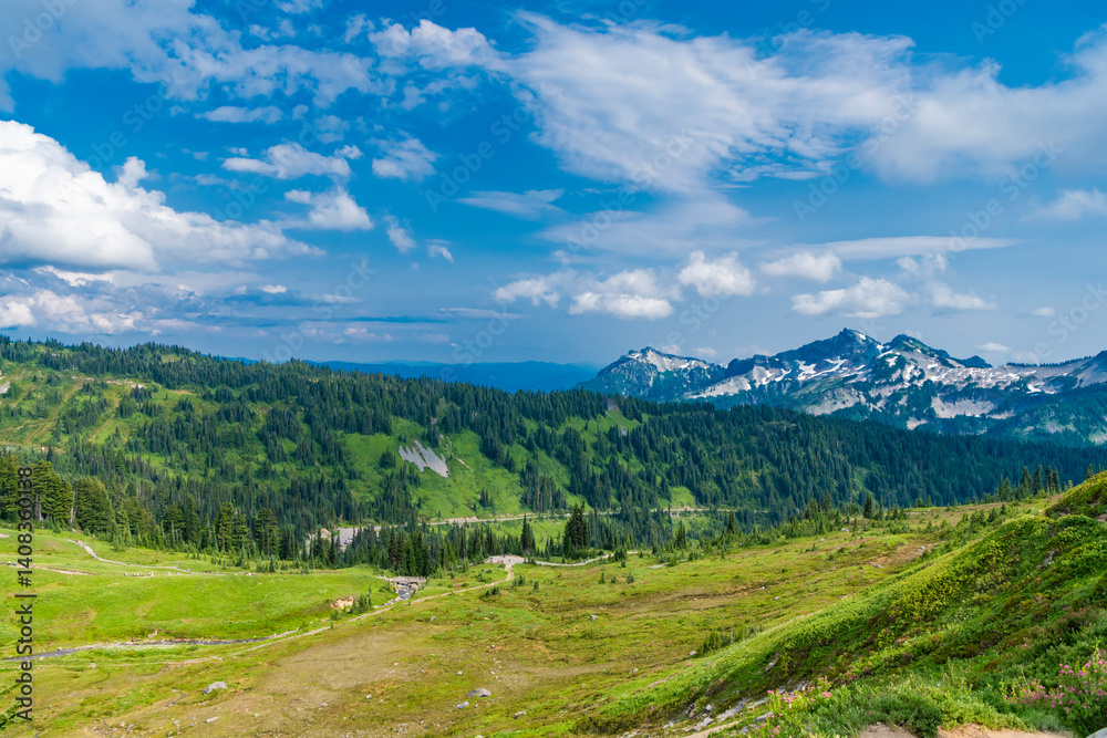 Mountainous landscape with cloudy sky. Scenic green hill mountain. Breathtaking summer day in wild mountain with green slopes. Mountain landscape with meadow. Travel destination Mountainous landscape with cloudy sky. Scenic green hill mountain. Breathtaking summer day in wild mountain with green slopes. Mountain landscape with meadow. Travel destination