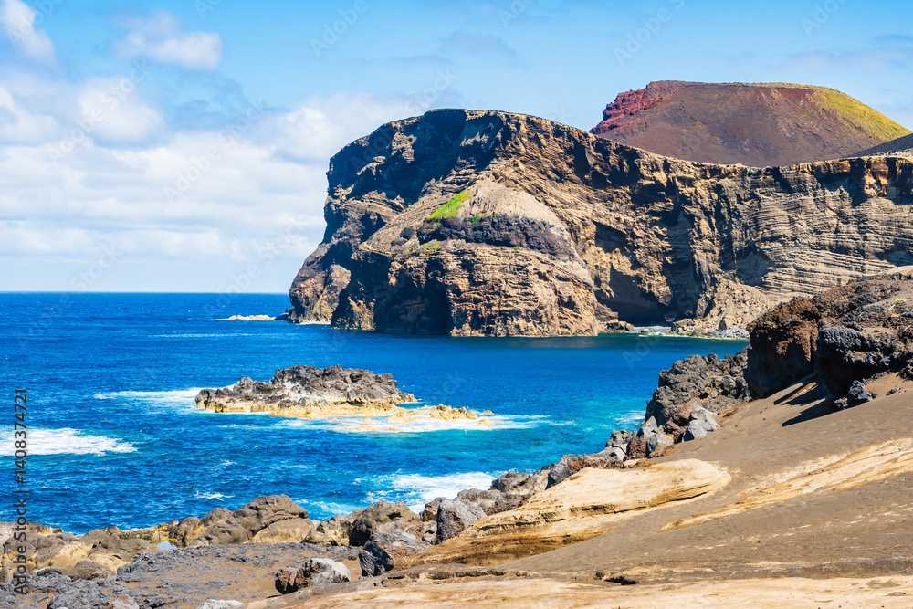 Stunning view of Capelinhos peninsula volcanic ocean coast and cliffs, Faial island, Azores, Portugal