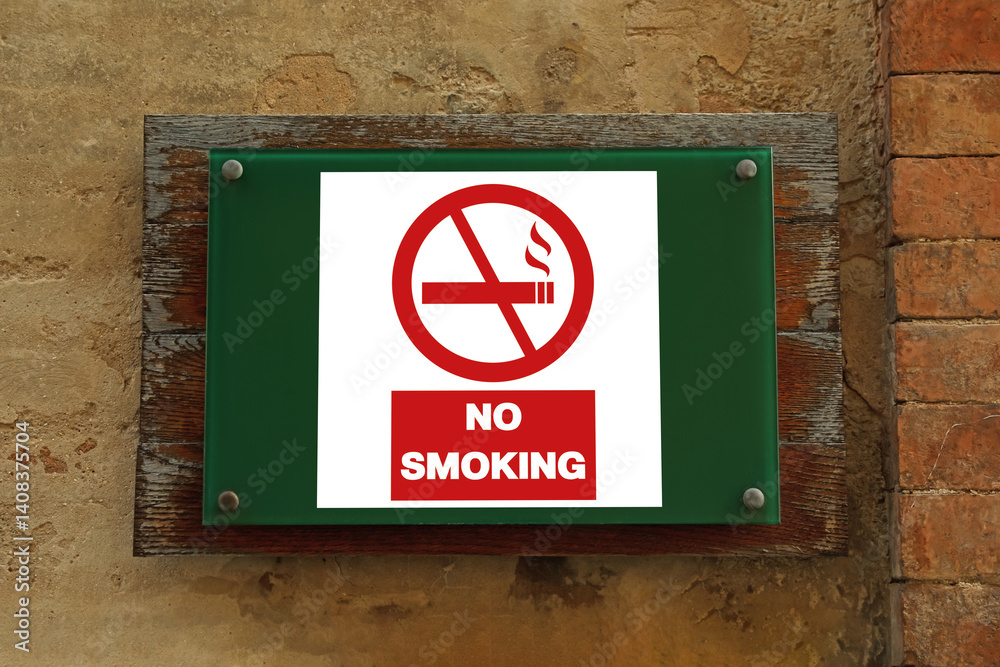 No Smoking sign on building wall outdoors No Smoking sign on building wall outdoors
