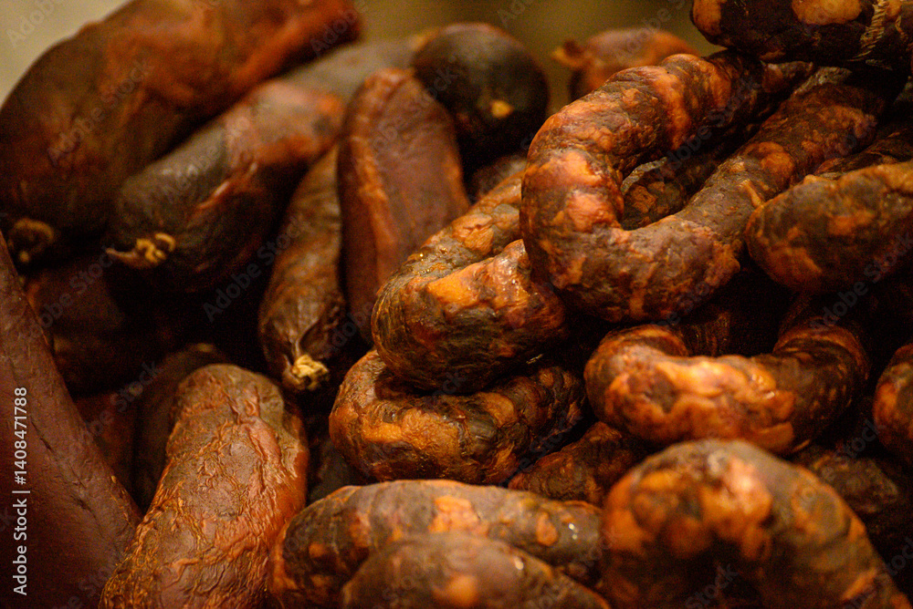 detail of smoked sausages made of pork meat called chouricos, typical gastronomy of northern portugal. Feira do Fumeiro event. Montalegre, Portugal detail of smoked sausages made of pork meat called chouricos, typical gastronomy of northern portugal. Feira do Fumeiro event. Montalegre, Portugal