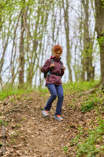 Obraz na płótnie Woman hiking on forest trail w salonie