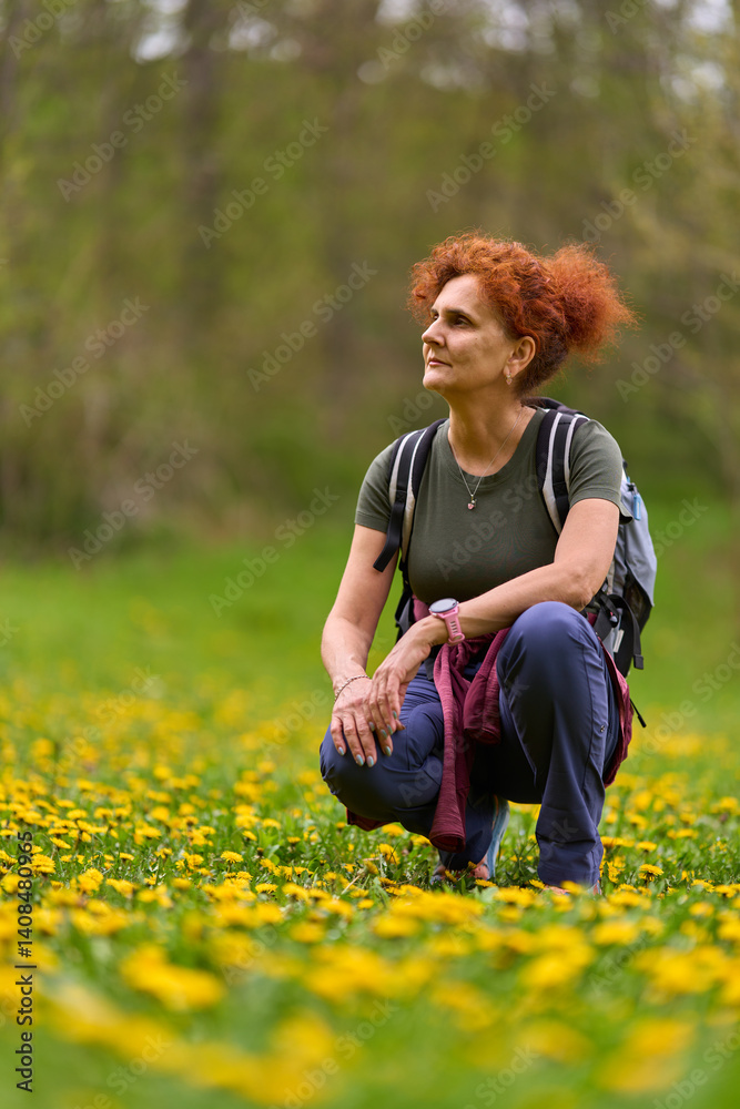 Woman resting in dandelion field