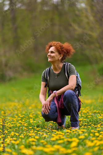 Obraz na płótnie Woman resting in dandelion field w salonie