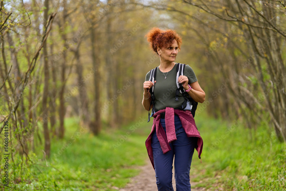 Woman hiking in spring forest
