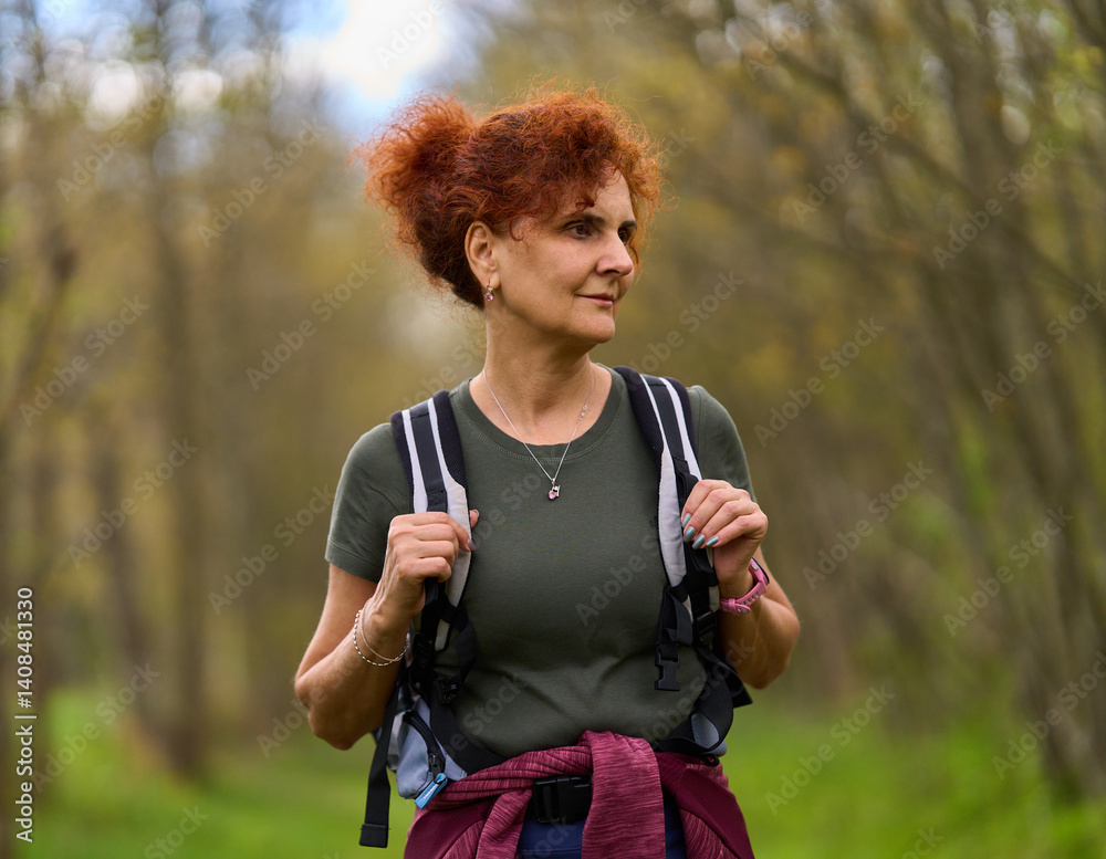 Woman hiking in spring forest