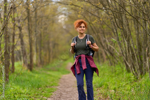 Woman hiking in spring forest