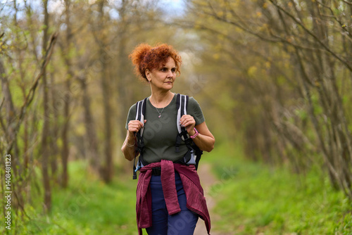 Obraz na płótnie Woman hiking in spring forest w salonie