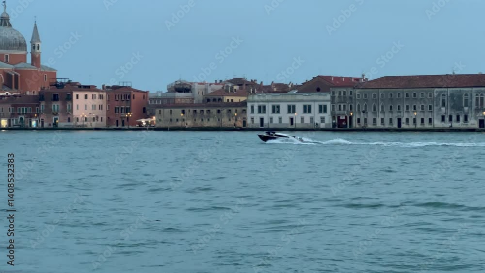 This video showcases a beautiful view of Venice, Italy, featuring gondolas docked along the waterfront and the stunning island views in the background This video showcases a beautiful view of Venice, Italy, featuring gondolas docked along the waterfront and the stunning island views in the background