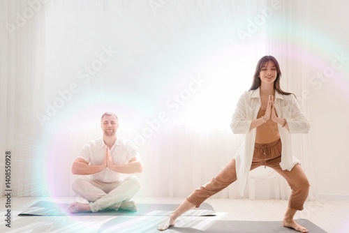 Sporty young couple meditat...
