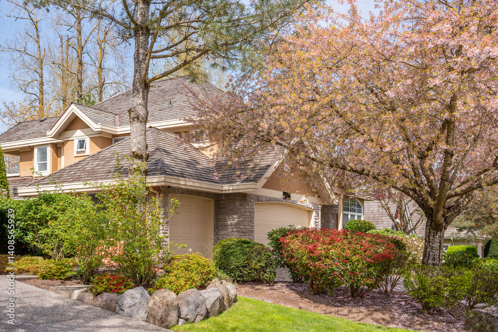 Fragment of luxury house in spring with green trees and nice landscape in Vancouver, Canada, North America. Day time on April 2025. Fragment of luxury house in spring with green trees and nice landscape in Vancouver, Canada, North America. Day time on April 2025.