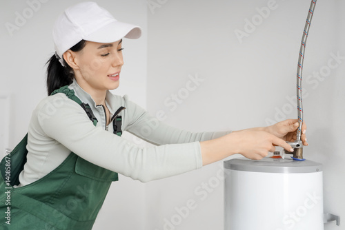 Female worker attaching fle...
