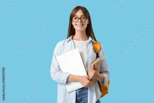 Happy female student with l...