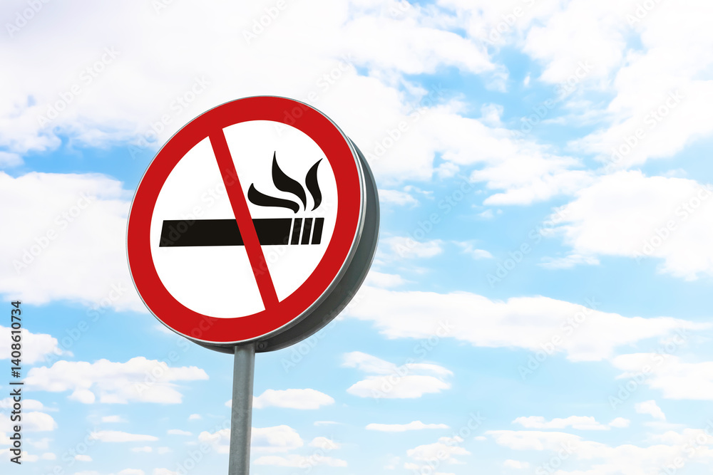 No Smoking sign against blue sky with clouds No Smoking sign against blue sky with clouds