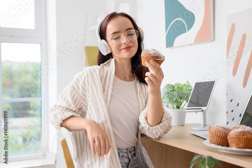 Young woman in headphones w...
