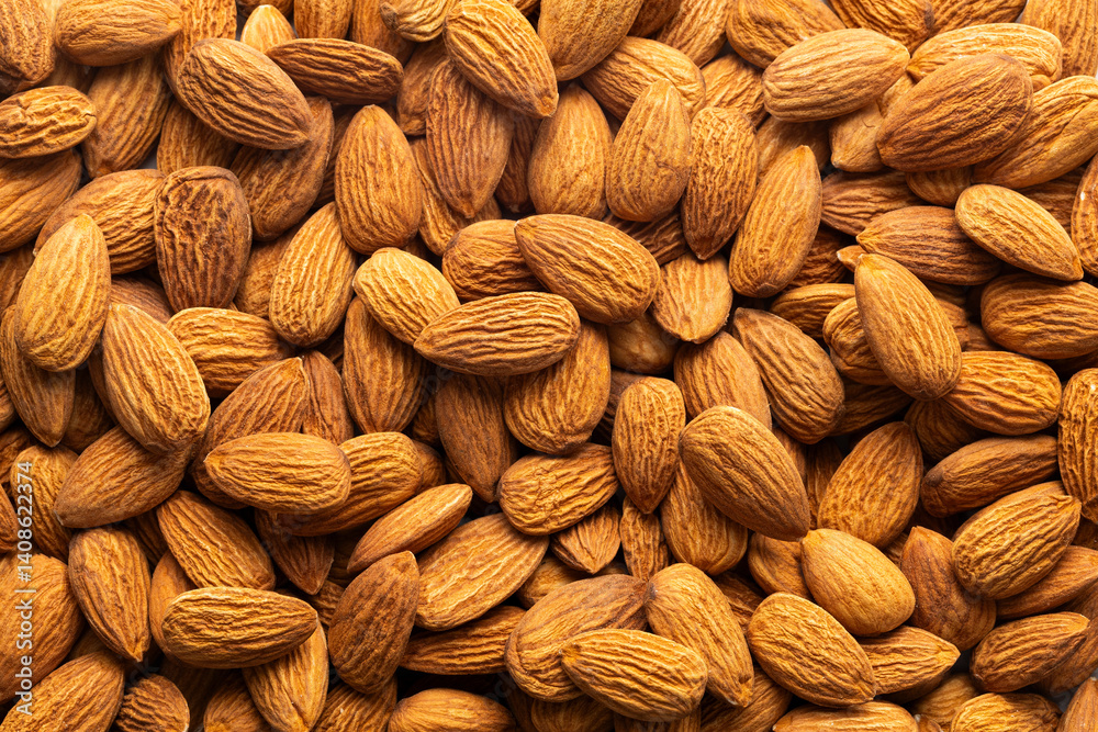 Fototapeta premium Prunus dulcis - Scattered raw organic dried almonds