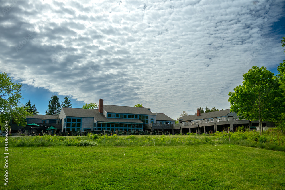 Sheet Of Clouds Pass Over Jordan Pond House In Acadia