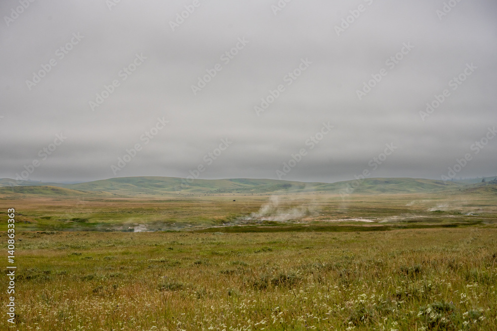 Steam Rises From Alum Creek With Bison Herd In The Distance