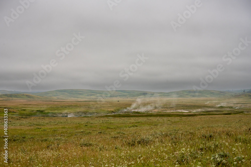 Obraz na płótnie Steam Rises From Alum Creek With Bison Herd In The Distance w salonie