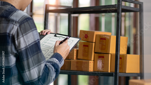 Obraz na płótnie Startup or small business entrepreneur,Check sales and check business growth reports,order management in online stores,shopping on the internet,Selling online on Internet,SME,shipping boxes,e-commerce w salonie