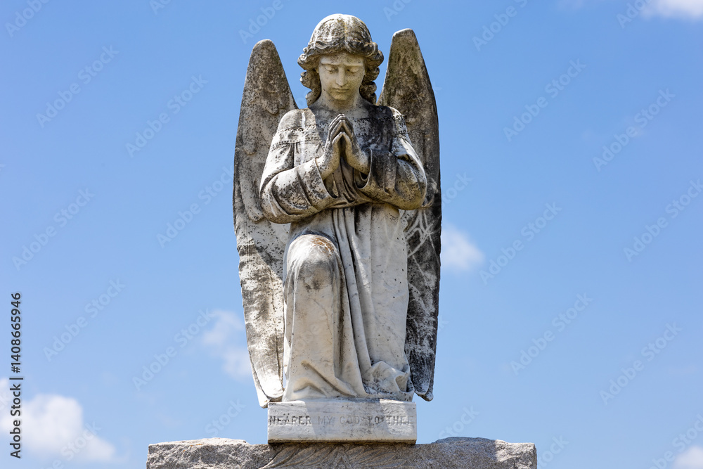 Fototapeta premium Beautiful angel tombstone topper sculpture