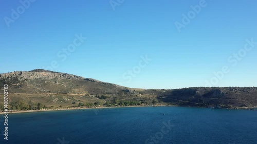 Wallpaper Mural Paralia Karathona beach on the arid coastline and its rurality, in Europe, Greece, Peloponnese, Argolis, Nafplio, on the Myrtos Sea, in summer, on a sunny day.  Torontodigital.ca
