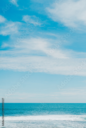 Fototapeta Naklejka Na Ścianę i Meble -  Relaxing beach scene with tropical water and blue sky, clean and calm vacation background.