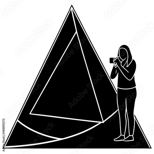 A silhouette of a tourist taking a picture in front of a giant pyramid