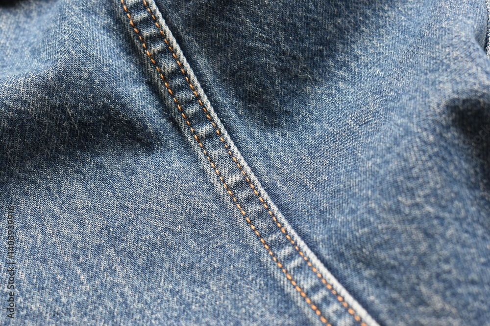 Fototapeta premium seam of blue denim texture background, jean fashion style