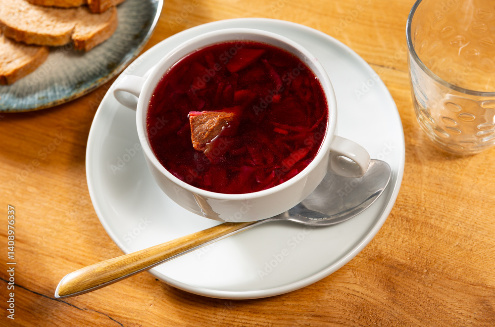 Appetizing shchi soup with beef broth and sauerkraut served in bowl Appetizing shchi soup with beef broth and sauerkraut served in bowl