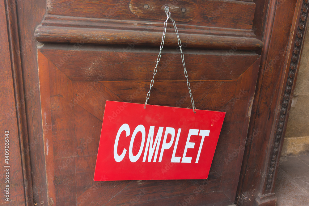 complet french sign text means full complete on panel board on wooden door hotel fully booked