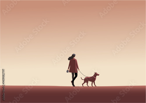 早朝に犬と散歩する女性