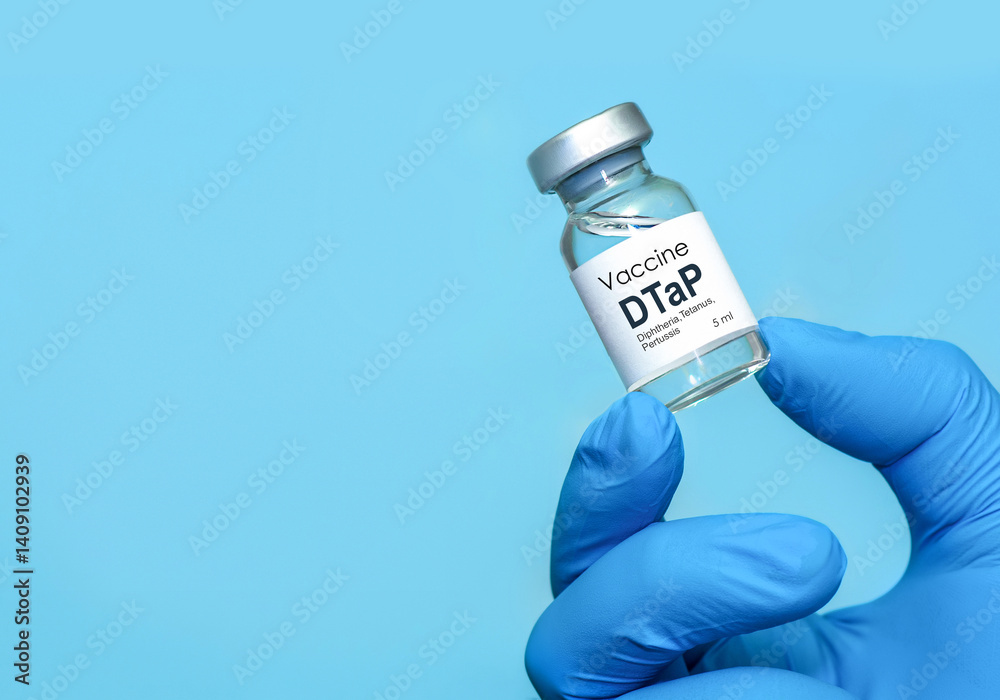 Doctor or nurse hand in medical gloves holds vaccine for DTaP diphtheria, tetanus and Pertussis. Concept of healthcare, immunization, medical protection, and scientific research in medicine.Copy space