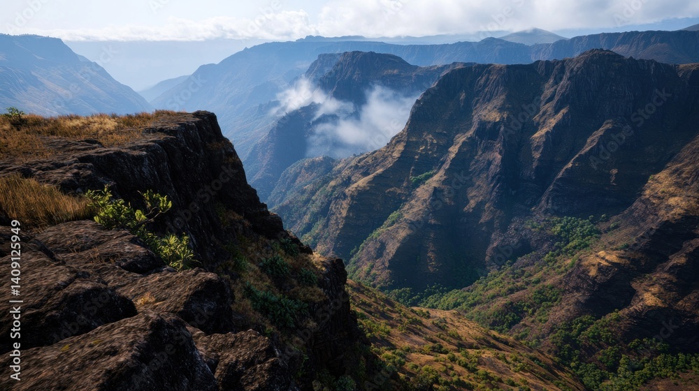 Fototapeta premium Mountain cliff edge view of valley with mist