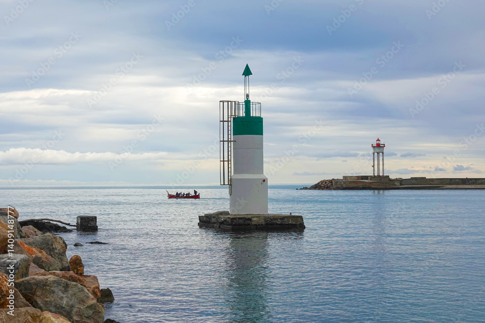 A distant lighthouse stands on a rocky shore. A small boat carries passengers across the calm sea