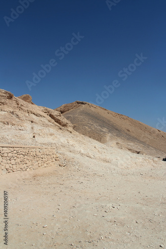 Limestone mountain against the blue sky at the Valley of the Kings in Luxor, Egypt