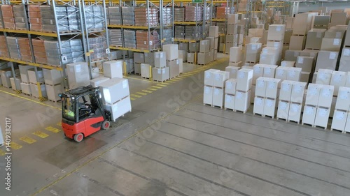 A top-down view of a forklift navigating a vast warehouse, highlighting the efficient organization and movement of goods.