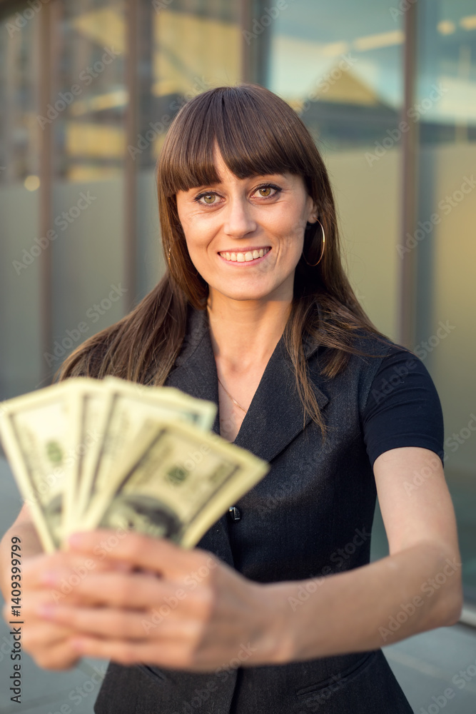Woman holding money, USA dollar. Businesswoman holding a lot of hundred dollar. Win the lottery or crypto trader. Woman holding money, USA dollar. Businesswoman holding a lot of hundred dollar. Win the lottery or crypto trader.