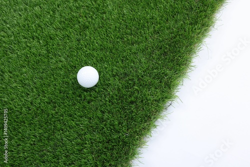 Obraz na płótnie Golf ball and green grass on white background, top view. Space for text w salonie