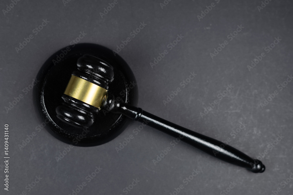 close up of gavel hammer against gray background close up of gavel hammer against gray background