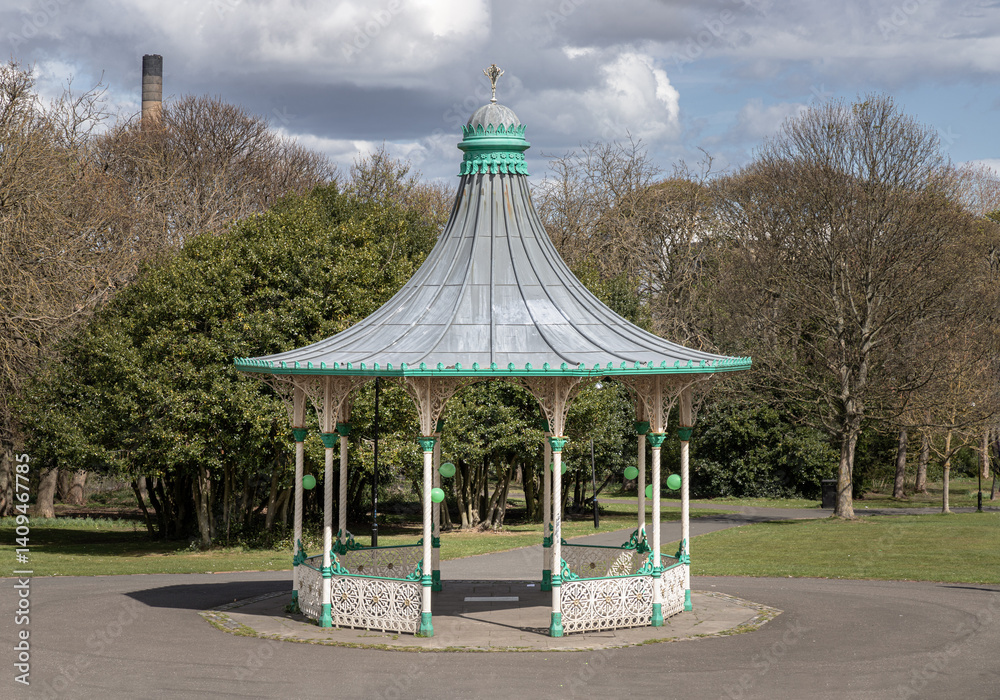 View of A Bandstand And A Grandstand. Its a modern replica of the Victorian bandstand that had been installed in the Leazes park. The Music Pavilion with Green trees in the background, Copy space.