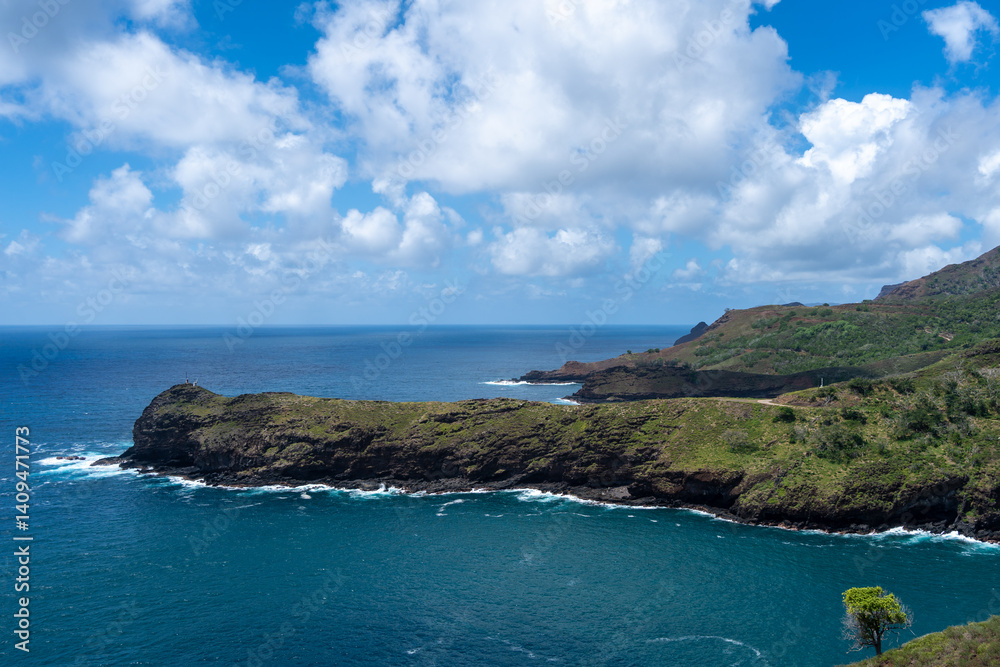 Coastal cliffs and turquoise bay near Puamau, Hiva Oa, Marquesas Islands, French Polynesia