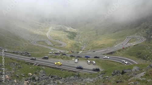 Car Traffic on Transfagarasan, Transalpine Roads in Romania, Mountains View Foggy Day