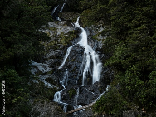 Closeup long exposure shot of Fantail Falls waterfall creek stream Haast River near Haast Pass in Mount Aspiring National Park Westland New Zealand