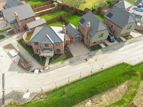 Obraz na płótnie Aerial view of expensive, detached family homes near completion on a British housing site. Notice the newly laid lawns. w salonie